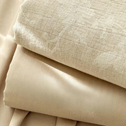 Copriletto in lino e cotone testurizzato con motivo floreale beige
