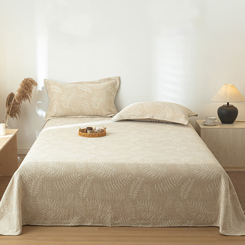 Copriletto in lino e cotone testurizzato beige con motivo botanico