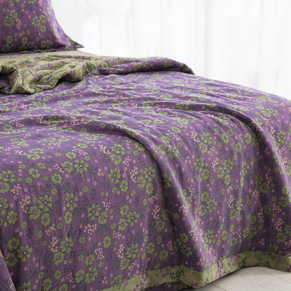 Trapunta jacquard in garza di cotone con motivo a fiori di prugna