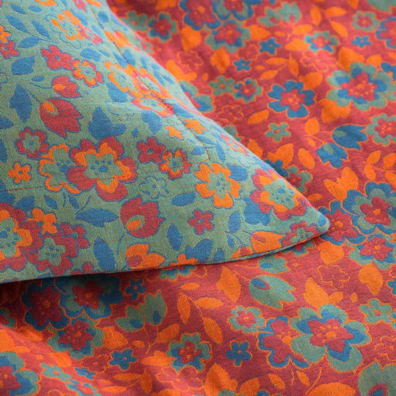 Trapunta jacquard in garza di cotone floreale arancione