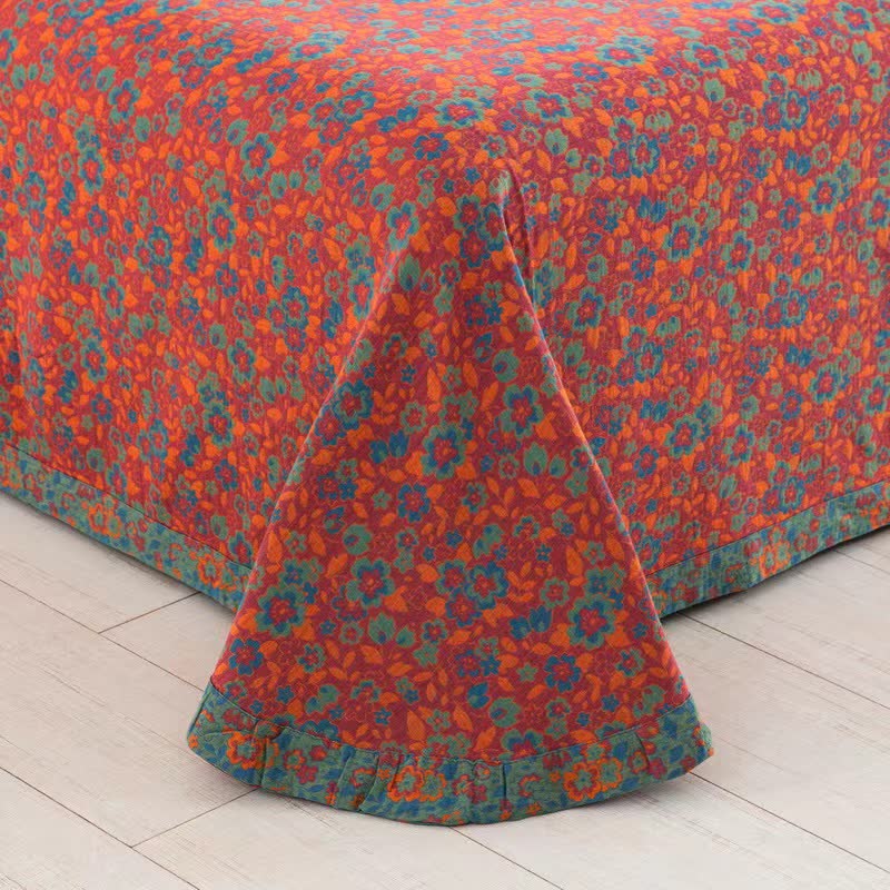 Trapunta jacquard in garza di cotone floreale arancione