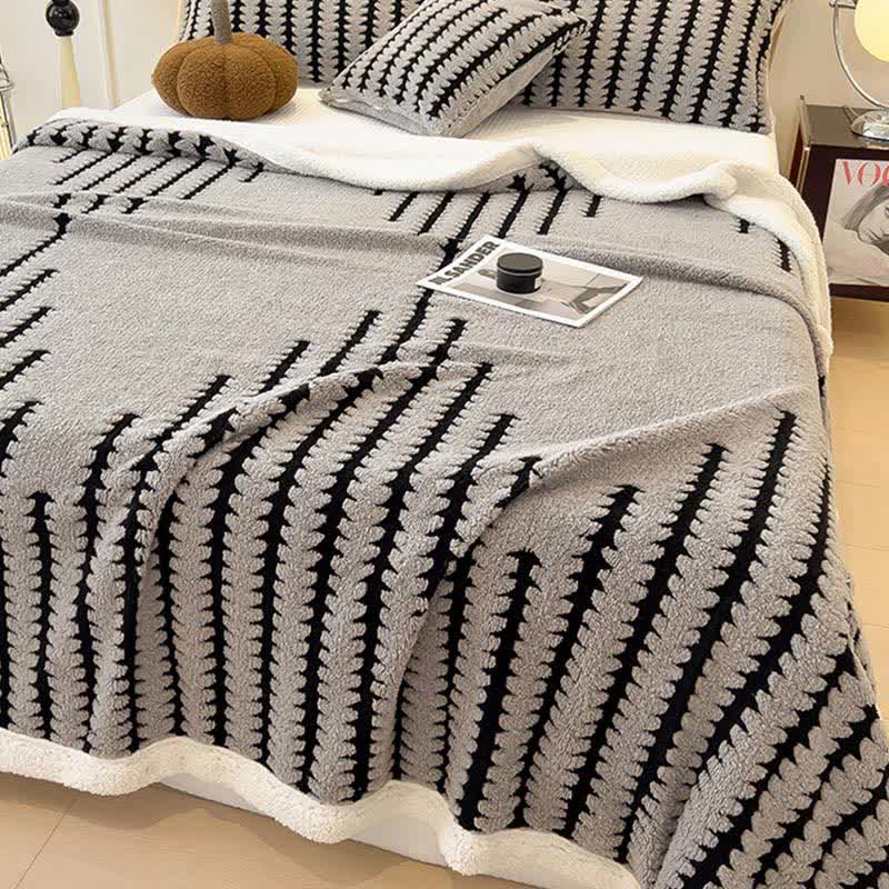 Coperta jacquard con stampa geometrica - image 5