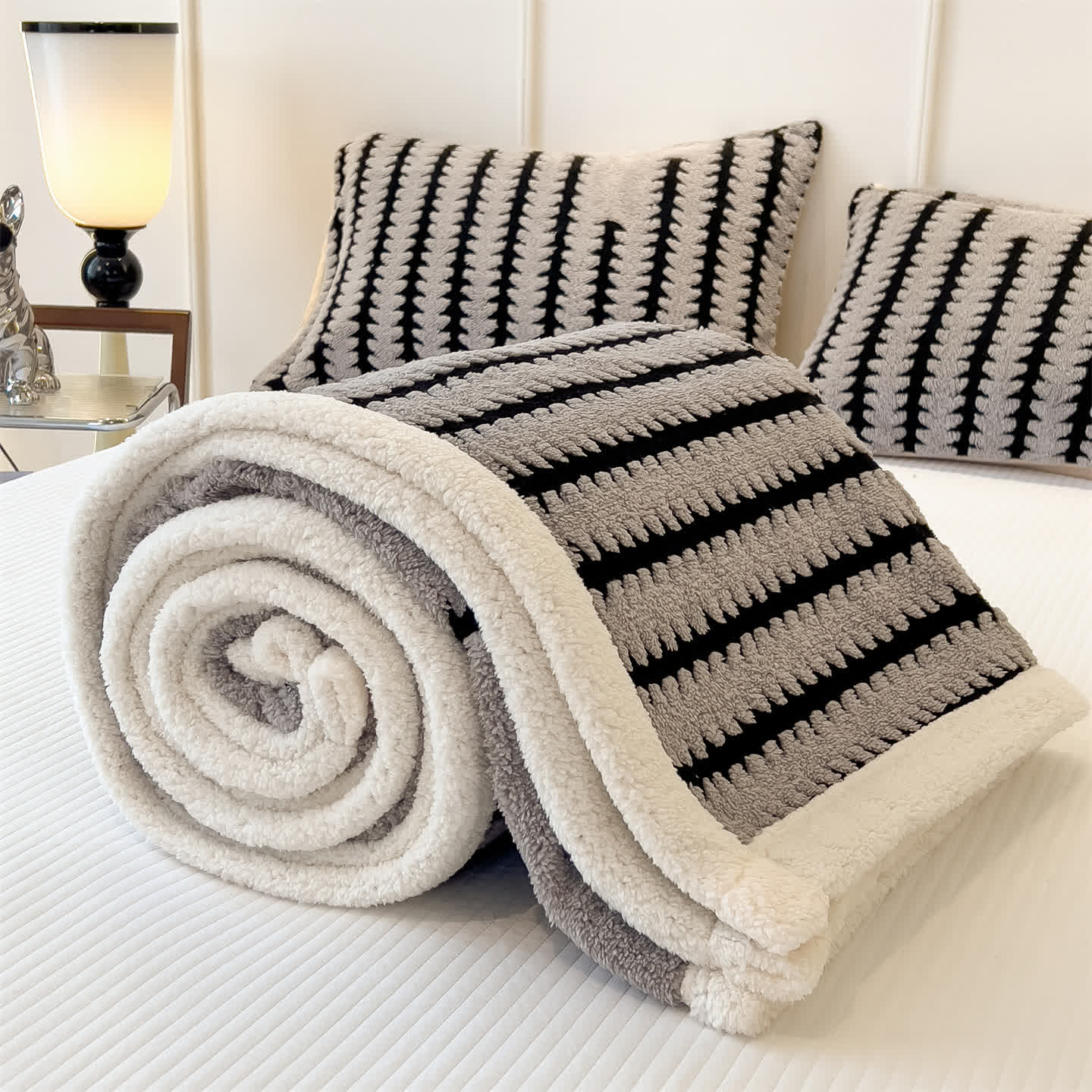 Coperta jacquard con stampa geometrica - image 9