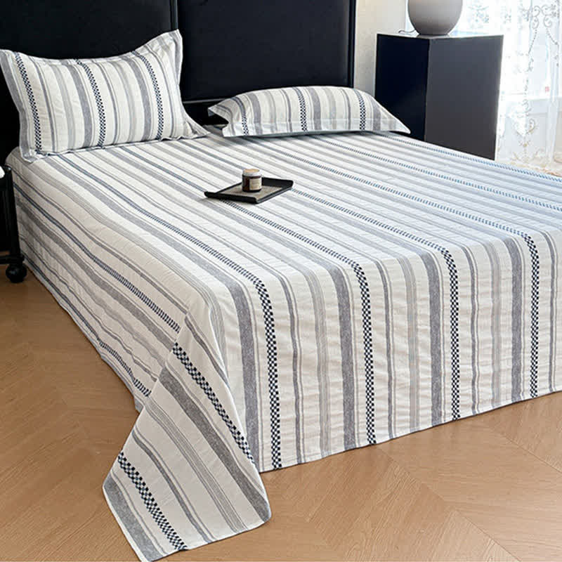 Copriletto in puro cotone jacquard a quadri - image 1