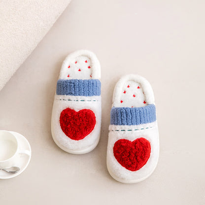 Pantofole di peluche con motivo a cuore - image 1