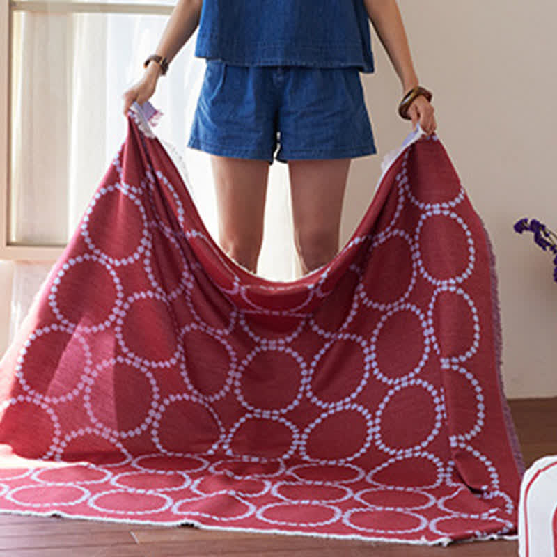 Coperta reversibile con motivo a cerchi e nappe - image 4