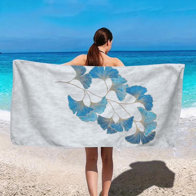 Elegante telo mare con foglie di ginkgo blu. - image 2
