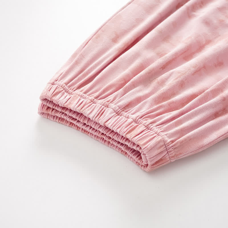 Completo da notte composto da canotta e pantaloni in cotone con stampe artistiche ispirate all'acquerello. - image 9