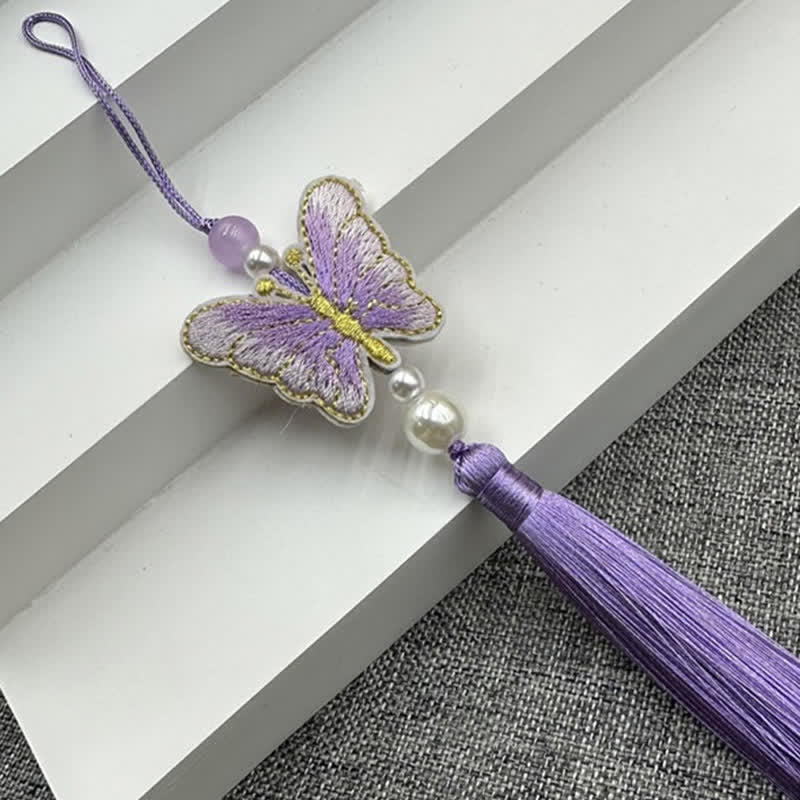 Cuscino decorativo con farfalle viola e motivi floreali - image 1