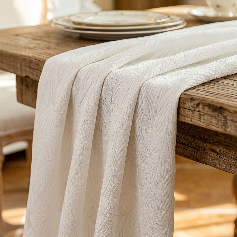 Tovaglia jacquard con motivo a foglie - image 4