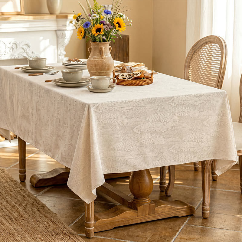 Tovaglia jacquard con motivo a foglie - image 3