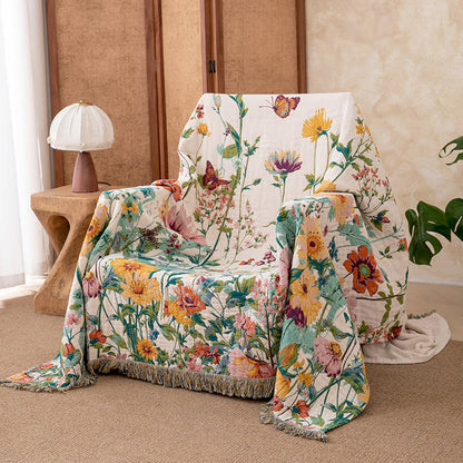 Trapunta reversibile in garza con frange e motivo floreale ad acquerello - image 1