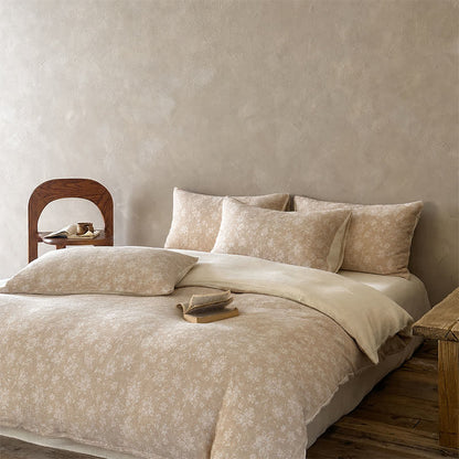 Set di biancheria da letto in cotone jacquard con delicati motivi floreali color cammello. - image 1