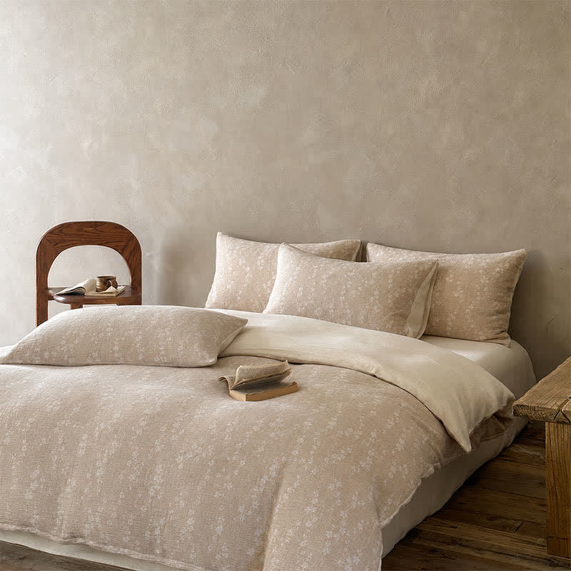 Set di biancheria da letto in cotone jacquard con delicato motivo floreale color cammello. - image 1