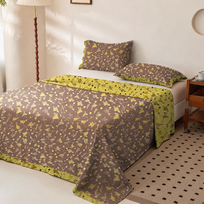 Copriletto in doppia garza di cotone con stampa floreale e motivo a papera. - image 1