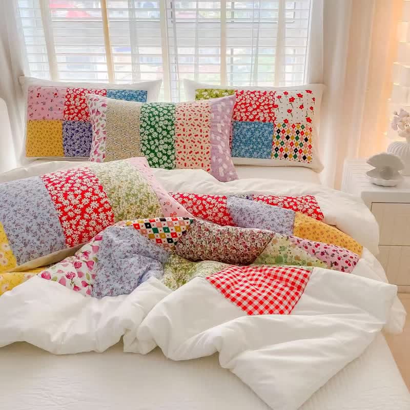 Set di biancheria da letto in cotone con motivo floreale e patchwork colorato - image 1