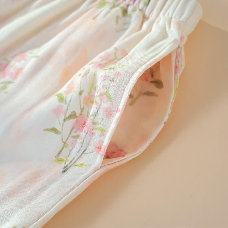 Pigiama in cotone di bambù con stampa floreale e laccetti al collo. - image 10