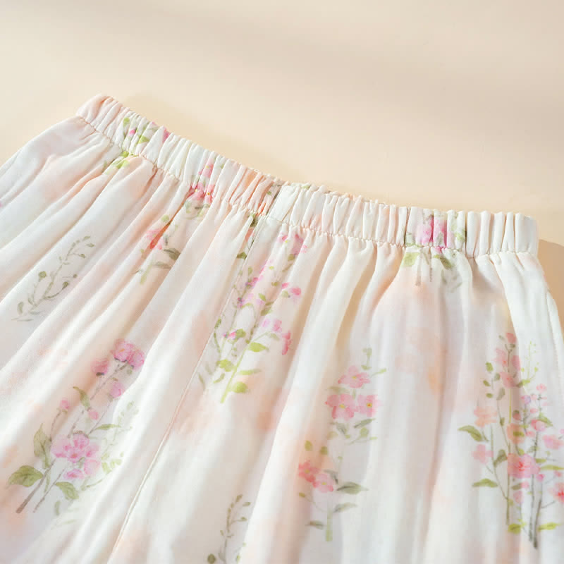 Pigiama in cotone di bambù con stampa floreale e laccetti al collo. - image 9
