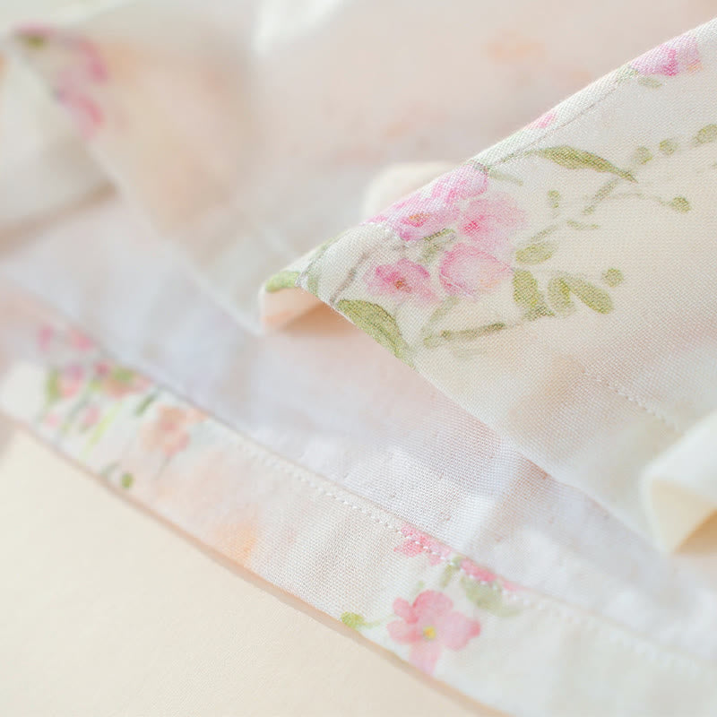Pigiama in cotone di bambù con stampa floreale e laccetti al collo. - image 12