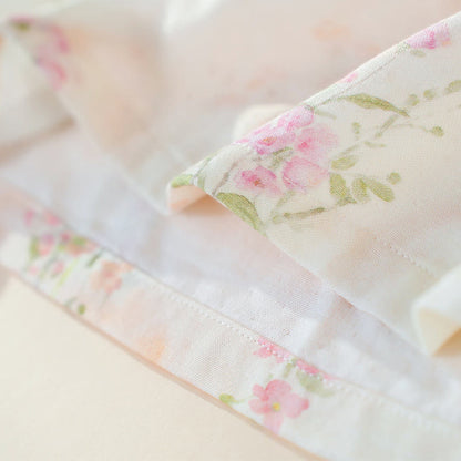 Pigiama in cotone di bambù con stampa floreale e laccetti al collo. - image 12