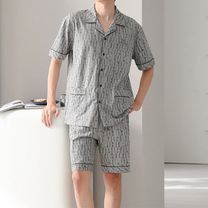 Set pigiama in cotone grigio con motivo astratto a linee. - image 1