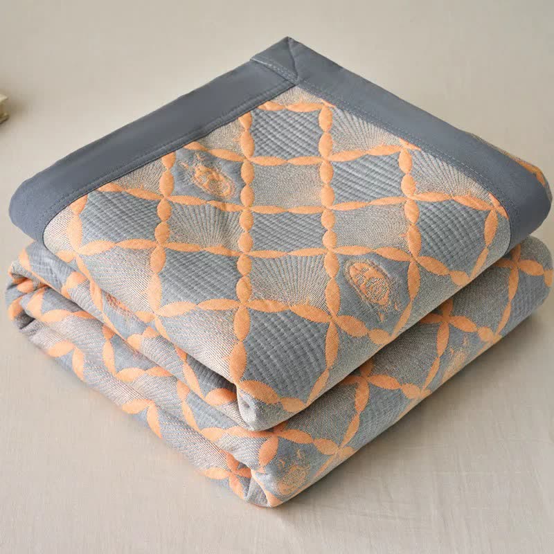 Trapunta reversibile in garza di cotone jacquard con motivo a reticolo - image 1