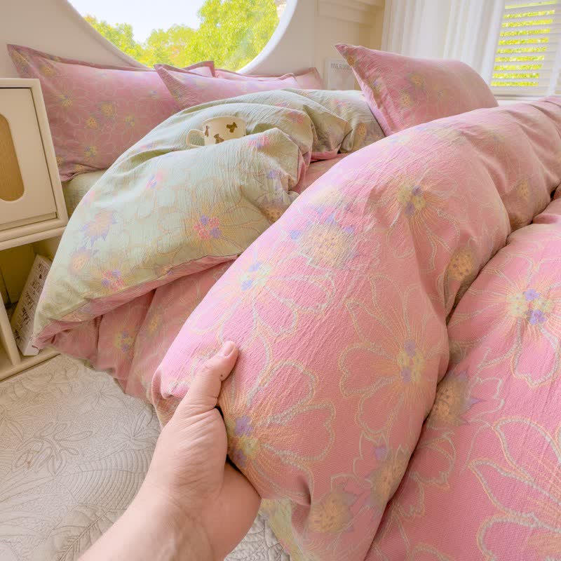 Set di 4 pezzi di biancheria da letto in doppia garza di cotone con stampa floreale pastello. - image 1