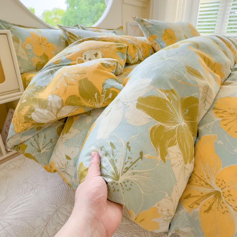 Set di 4 lenzuola in doppia garza di cotone con motivo floreale a gigli. - image 1