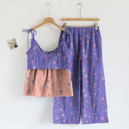 Completo composto da canotta e pantaloni da casa con stampa a farfalle. - image 1