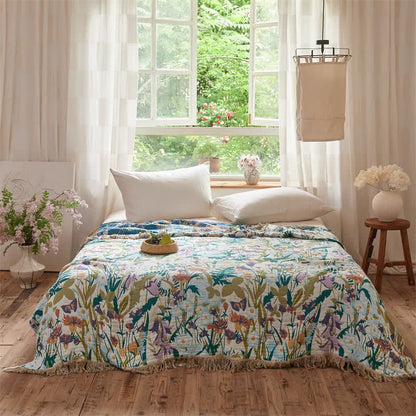 Coperta trapuntata reversibile in mussola con nappe botaniche - image 1