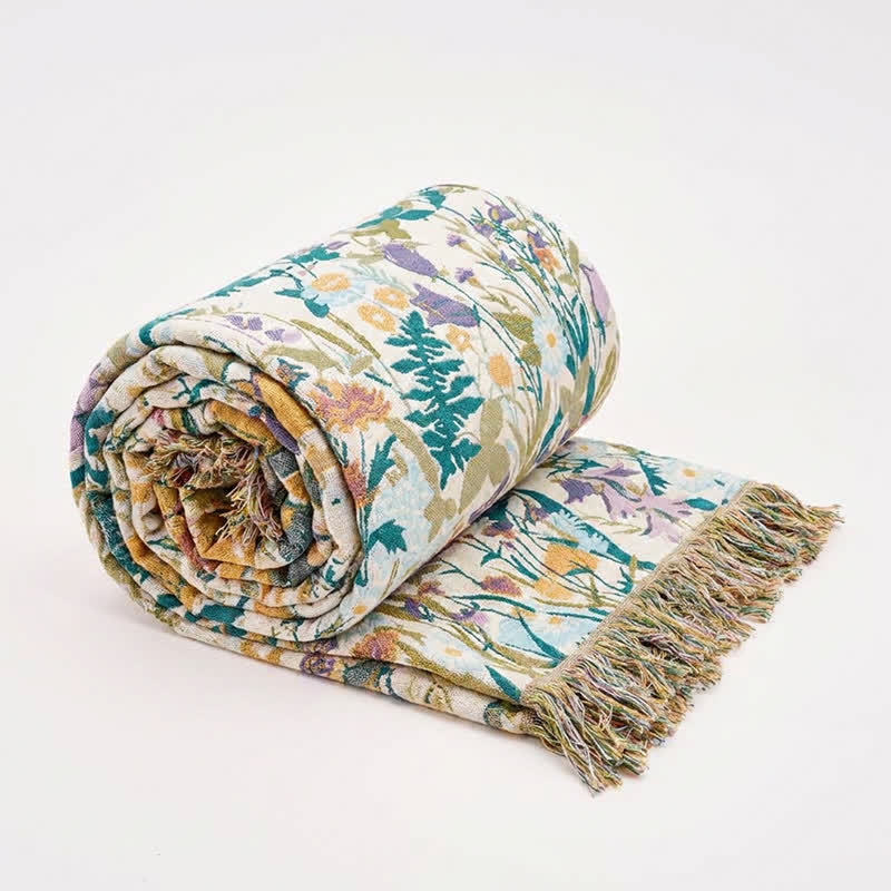Coperta trapuntata reversibile in mussola con nappe botaniche - image 0