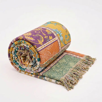 Trapunta boho in cotone patchwork con motivi floreali e nappe - image 0