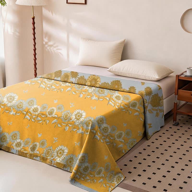 Copriletto reversibile in garza di cotone con motivo girasoli e farfalle - image 1