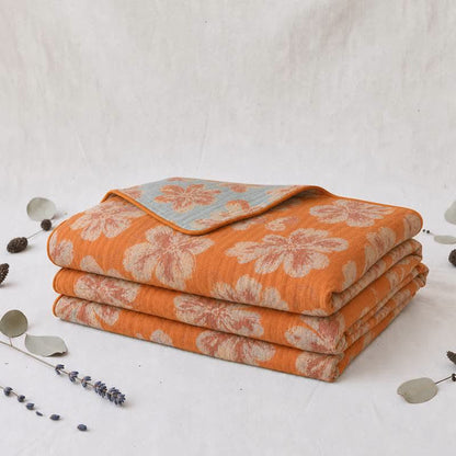Trapunta reversibile in cotone con fiori arancioni e blu - image 3