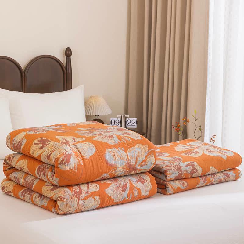 Trapunta reversibile in cotone con fiori arancioni e blu - image 1