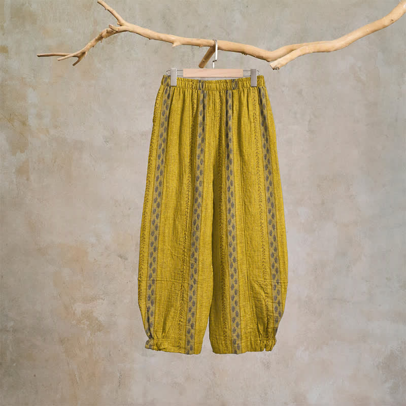 Pantaloni harem in cotone a righe gialle con motivo a foglie - image 1