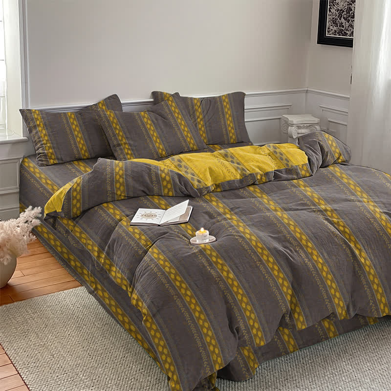 Set di biancheria da letto con copripiumino reversibile in cotone a righe e motivo a foglie. - image 7
