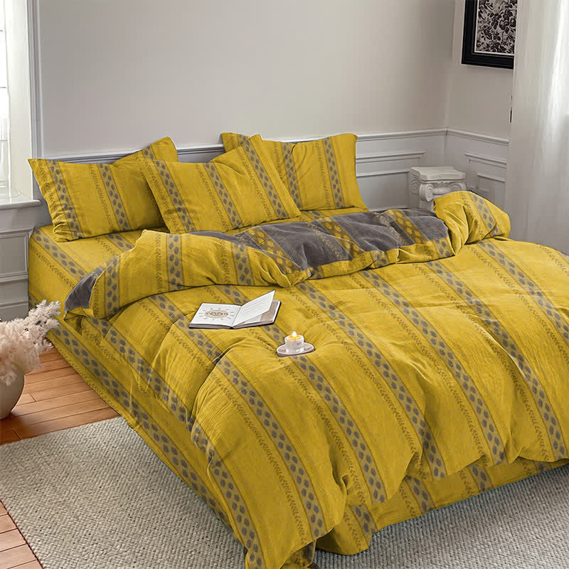 Set di biancheria da letto con copripiumino reversibile in cotone a righe e motivo a foglie. - image 2