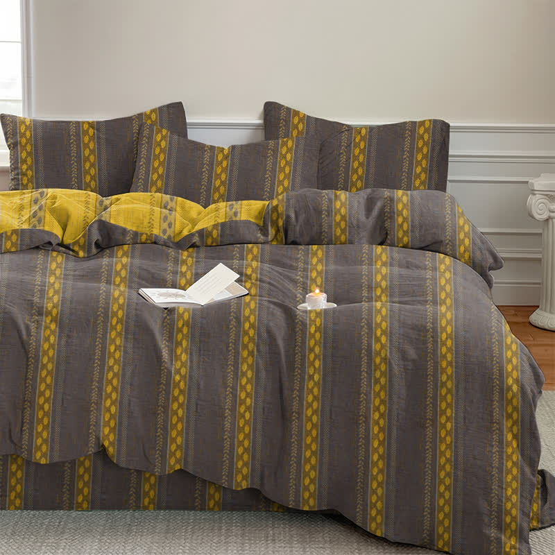 Set di biancheria da letto con copripiumino reversibile in cotone a righe e motivo a foglie. - image 6