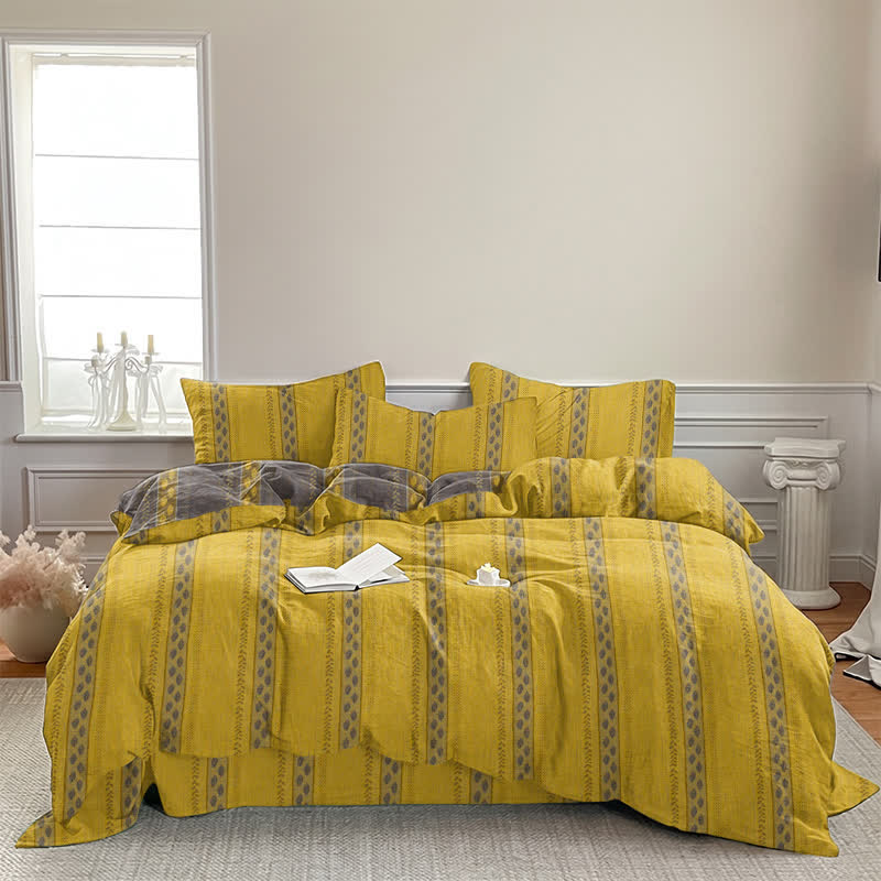 Set di biancheria da letto con copripiumino reversibile in cotone a righe e motivo a foglie. - image 3