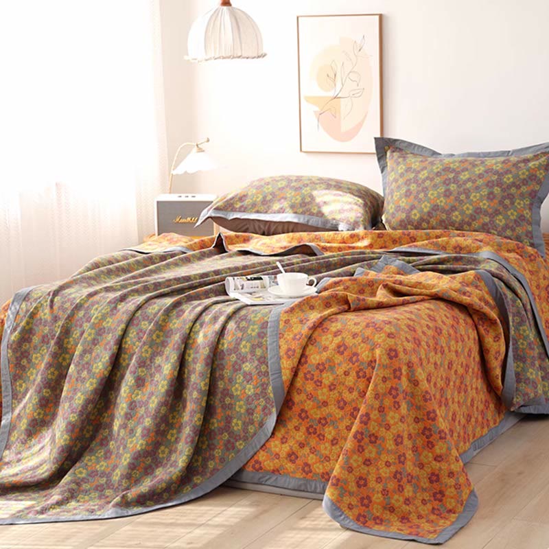 Trapunta reversibile in garza di cotone jacquard floreale
