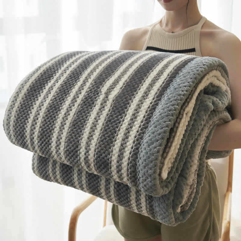 Coperta in pile di corallo a righe
