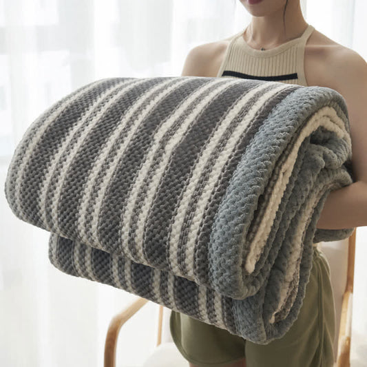 Coperta in pile di corallo a righe