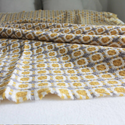 Coperta per divano lavorata a maglia Ownkoti con nappe