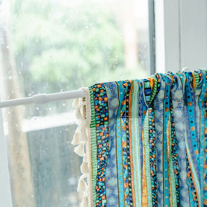 Tenda a strati con nappe a motivo scozzese colorato