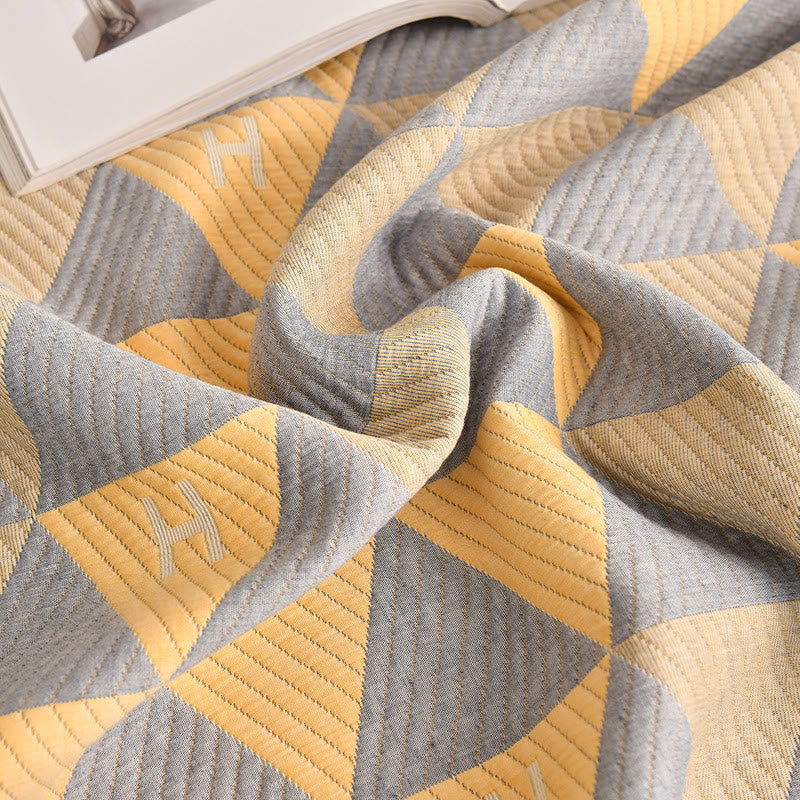 Trapunta in cotone grigio e giallo con motivo triangolare Ownkoti