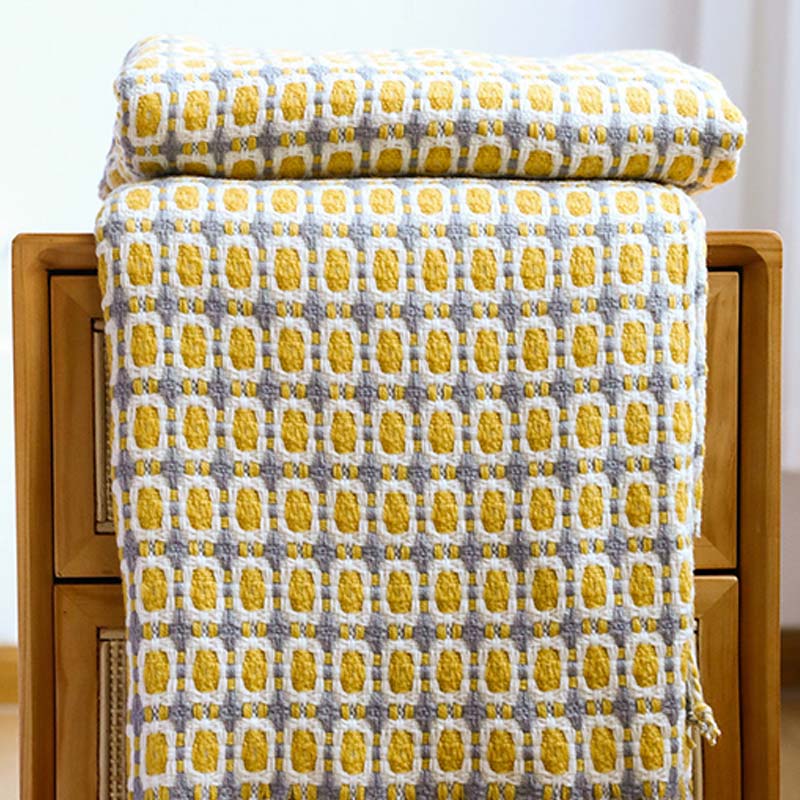 Coperta per divano lavorata a maglia Ownkoti con nappe
