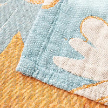 Trapunta reversibile in morbido cotone stampato con margherite