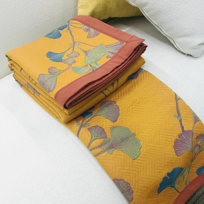 Trapunta reversibile in cotone jacquard con foglie di ginkgo
