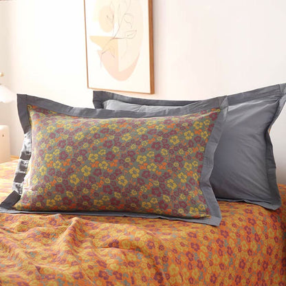 Trapunta reversibile in garza di cotone jacquard floreale